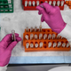 A lab technician sorts blood samples for a covid-19 vaccination study at the Research Centers of America in Hollywood, Florida on August 13, 2020.